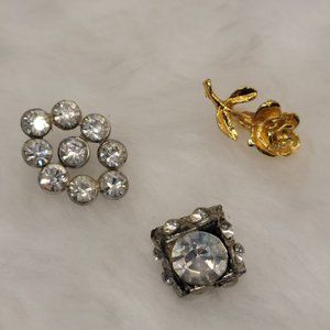Three vintage silver tone and gold tone lapel pins